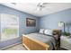 Bedroom with a window, ceiling fan, and comfortable bed with a soft color scheme at 2080 Bancroft Ln, Mount Pleasant, SC 29466