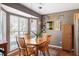 Charming dining room with natural light, pendant lighting, and a wooden dining table at 2080 Bancroft Ln, Mount Pleasant, SC 29466