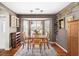 Cozy dining room with a bay window, hardwood floors, and elegant light fixtures at 2080 Bancroft Ln, Mount Pleasant, SC 29466