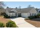 Charming single-story home with a well manicured lawn and attached two-car garage at 2080 Bancroft Ln, Mount Pleasant, SC 29466