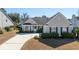 Inviting home boasts neat landscaping, a charming front porch, and a well-maintained exterior at 2080 Bancroft Ln, Mount Pleasant, SC 29466