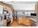 Modern kitchen featuring stainless steel appliances, wooden cabinets, and granite countertops at 2080 Bancroft Ln, Mount Pleasant, SC 29466