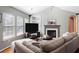 Sun-filled living room with a fireplace, large windows, and comfortable seating area at 2080 Bancroft Ln, Mount Pleasant, SC 29466
