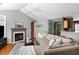 Comfortable living area featuring a fireplace, an open floor plan and hardwood floors at 2080 Bancroft Ln, Mount Pleasant, SC 29466