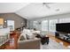 Bright living room with hardwood floors, large windows, and sliding doors to the outside at 2080 Bancroft Ln, Mount Pleasant, SC 29466