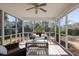 Bright sunroom with wicker furniture, tile flooring and views of the backyard at 2080 Bancroft Ln, Mount Pleasant, SC 29466