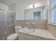 Bathroom featuring a shower, mirror, toilet, and vanity sink at 2529 Otranto Rd, North Charleston, SC 29406