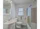 Bright bathroom featuring a vanity sink, toilet, and shower with glass door at 2529 Otranto Rd, North Charleston, SC 29406