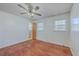 Bedroom with hardwood flooring, ceiling fan, and access to a bathroom at 2529 Otranto Rd, North Charleston, SC 29406