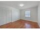 Bedroom with hardwood flooring, a window and a spacious closet at 2529 Otranto Rd, North Charleston, SC 29406