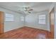 Bright bedroom with hardwood floors, ceiling fan, and two windows at 2529 Otranto Rd, North Charleston, SC 29406