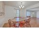 Traditional dining room with hardwood floors, wainscoting, chandelier, and large table set for six at 2529 Otranto Rd, North Charleston, SC 29406