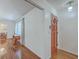 Bright entryway featuring hardwood floors, a wooden front door, and access to the living and dining areas at 2529 Otranto Rd, North Charleston, SC 29406