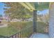 Charming covered front porch with decorative railings and columns, surrounded by lush landscaping at 2529 Otranto Rd, North Charleston, SC 29406