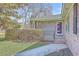 Charming brick home featuring a cozy front porch and lush greenery, offering a warm and inviting entry at 2529 Otranto Rd, North Charleston, SC 29406