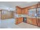 This kitchen features wood cabinets, a breakfast bar and tile floors at 2529 Otranto Rd, North Charleston, SC 29406