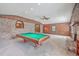 Large game room featuring a pool table, brick fireplace, and neutral carpeting at 2529 Otranto Rd, North Charleston, SC 29406