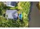 An aerial view highlights the pool and the house surrounded by large green space at 2664 Magnolia Woods Dr, Mount Pleasant, SC 29464