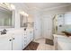 Bright bathroom featuring double sinks, white cabinets, and a glass-enclosed shower at 2664 Magnolia Woods Dr, Mount Pleasant, SC 29464