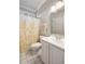 Bright bathroom featuring a decorative shower curtain, vanity with white cabinetry and a framed mirror at 2664 Magnolia Woods Dr, Mount Pleasant, SC 29464