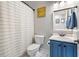 Clean bathroom with a blue vanity, tiled floor, and shower-tub combination at 2664 Magnolia Woods Dr, Mount Pleasant, SC 29464