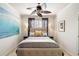 This is a lovely bedroom with a ceiling fan, large blue wall art and neutral color palette at 2664 Magnolia Woods Dr, Mount Pleasant, SC 29464