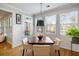 Bright dining area with wood floors, large windows, and access to a porch at 2664 Magnolia Woods Dr, Mount Pleasant, SC 29464