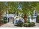 Charming two-story blue home with double garages, palm tree and a white staircase at 2664 Magnolia Woods Dr, Mount Pleasant, SC 29464