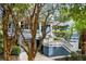 Charming two-story blue home with double garages, second story deck and a white staircase at 2664 Magnolia Woods Dr, Mount Pleasant, SC 29464