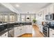 Well-equipped kitchen with stainless steel appliances, granite countertops, and ample natural light at 2664 Magnolia Woods Dr, Mount Pleasant, SC 29464