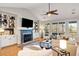 Bright living room with fireplace, built-in shelving, and large windows with natural light at 2664 Magnolia Woods Dr, Mount Pleasant, SC 29464