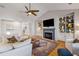 Cozy living room with fireplace, built-in shelving, and hardwood flooring at 2664 Magnolia Woods Dr, Mount Pleasant, SC 29464