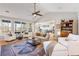 Spacious living room with vaulted ceiling, a ceiling fan, white furniture and an open floor plan at 2664 Magnolia Woods Dr, Mount Pleasant, SC 29464