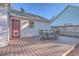 Deck with an outdoor dining set near a red door of the house at 2872 N Moss Oak Ln, Charleston, SC 29414