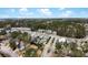 Aerial view of a street lined with neatly arranged homes surrounded by mature trees and landscaping at 2876 Rivertowne Pkwy, Mount Pleasant, SC 29466