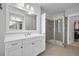 Bathroom featuring white cabinets, a glass shower and a doorway leading to a walk-in closet at 2876 Rivertowne Pkwy, Mount Pleasant, SC 29466