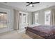 Inviting bedroom with plush bedding and large windows offering scenic views at 2876 Rivertowne Pkwy, Mount Pleasant, SC 29466