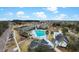Aerial view showcasing a community pool, tennis courts, a playground, and scenic walking paths at 2876 Rivertowne Pkwy, Mount Pleasant, SC 29466