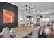 Open-concept dining area with modern lighting and seamless transition to the kitchen at 2876 Rivertowne Pkwy, Mount Pleasant, SC 29466