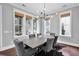Stylish dining room featuring a modern light fixture and windows with woven shades at 2876 Rivertowne Pkwy, Mount Pleasant, SC 29466