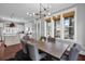 Elegant dining room with large windows and a view into the kitchen area at 2876 Rivertowne Pkwy, Mount Pleasant, SC 29466