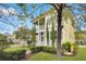 Beautiful two-story home featuring manicured lawn and inviting porch spaces at 2876 Rivertowne Pkwy, Mount Pleasant, SC 29466