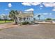 Scenic gazebo with a charming design, surrounded by lush landscaping, perfect for outdoor gatherings or relaxation at 2876 Rivertowne Pkwy, Mount Pleasant, SC 29466