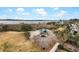 Aerial view of a charming gazebo by the river surrounded by lush green spaces and beautiful landscaping at 2876 Rivertowne Pkwy, Mount Pleasant, SC 29466
