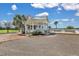 Scenic gazebo with a charming design, surrounded by lush landscaping, perfect for outdoor gatherings or relaxation at 2876 Rivertowne Pkwy, Mount Pleasant, SC 29466