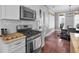 Modern kitchen with stainless steel appliances and a view into the dining area at 2876 Rivertowne Pkwy, Mount Pleasant, SC 29466