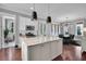 Open kitchen with granite island, stainless appliances, and dining area at 2876 Rivertowne Pkwy, Mount Pleasant, SC 29466