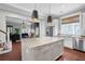 Kitchen featuring an island with granite countertops, pendant lights, and open access to living areas at 2876 Rivertowne Pkwy, Mount Pleasant, SC 29466