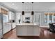Spacious kitchen featuring white cabinets, granite countertops, stainless steel appliances, and a center island at 2876 Rivertowne Pkwy, Mount Pleasant, SC 29466
