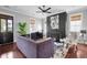 Bright living room featuring a fireplace with modern artwork, hardwood floors, and stylish furniture at 2876 Rivertowne Pkwy, Mount Pleasant, SC 29466